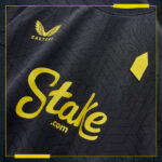Official Everton away football jersey for 2024/25 season, black with yellow accents, featuring spons.