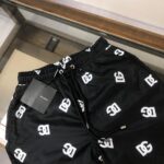 DG All Over Black Swimwear Short for Men, stylish and comfortable beachwear. Perfect for swimming an.