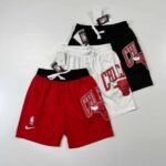 High-quality Chicago Bulls fleece shorts in red, white, and black, featuring team logo and comfortab.