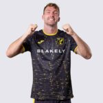 Norwich City away football jersey 2024/25 with team logo and modern design.