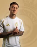 Cristiano Ronaldo wearing AL Nassr third jersey 24/25 with logo, white and gold design, official foo.