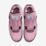 Pink Air Jordan 4 Orchid sneakers with black accents, front view.