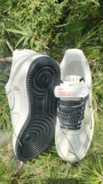 Air Force Low 1 07 White Black sneaker with black and white laces, low-top design, and durable rubbe.