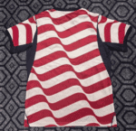 Vibrant red and white wavy striped soccer jersey with navy accents, ideal for football matches.