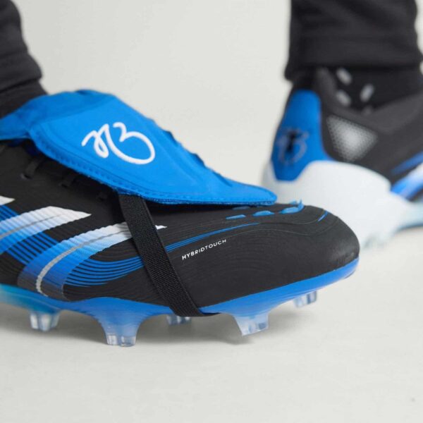 Football boots with blue and black design, hybrid touch technology, and firm ground studs for optima.