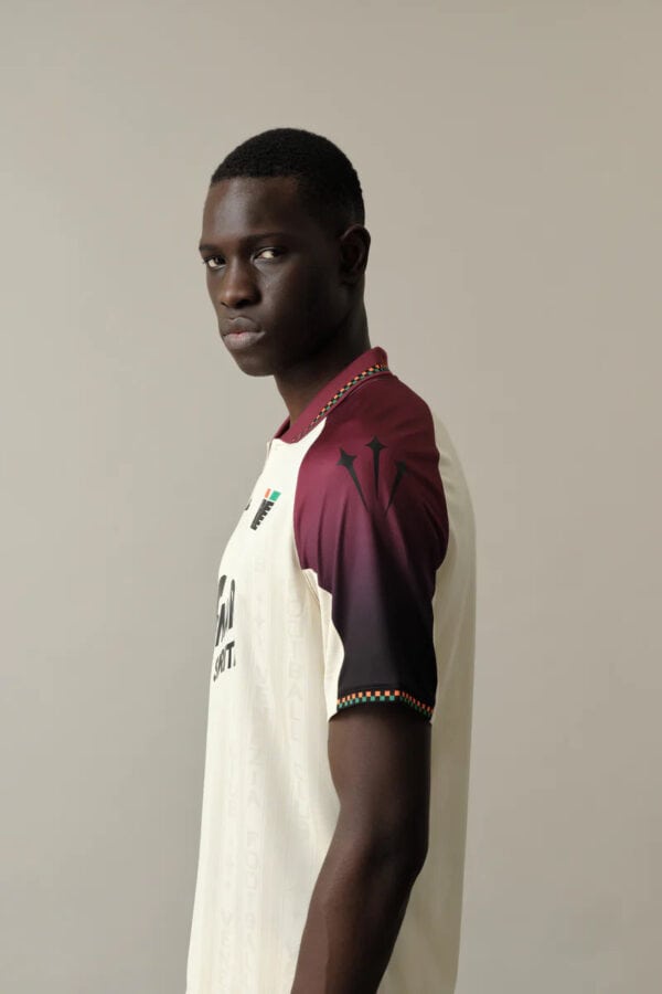 Men's football jersey with maroon and white design, perfect for sports fans.