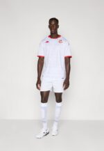 Authentic white football jersey with red trim, team crest, and sponsor logo for soccer fans.