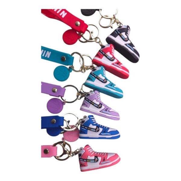 Colorful Nike sneaker keychain with vibrant design and metal keyring attachment. Perfect for sports.