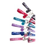 Nike sneaker keychain with colorful laces and shoe design, perfect for sports fans and collectors.