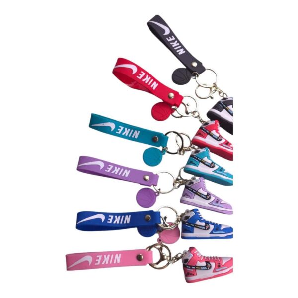 Nike sneaker keychain with colorful laces and shoe design, perfect for sports fans and collectors.