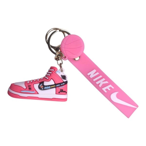 Mini Nike sneaker keychain with pink basketball and strap, perfect for sports fans and sneaker enthu.