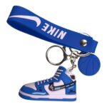 Nike sneaker keychain with blue and white design, sports-themed accessory.