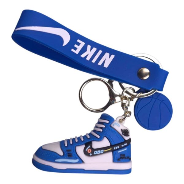 Nike sneaker keychain with blue and white design, sports-themed accessory.