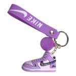 Nike sneaker keychain with purple lanyard and basketball charm, perfect for sports fans and sneaker.