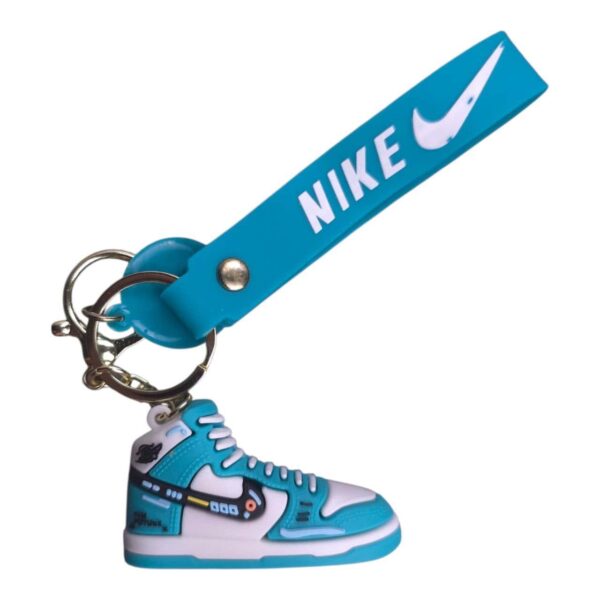 Bright blue Nike sneaker keychain with white accents and logo.