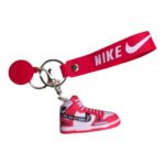 Keychain with mini Nike sneaker in vibrant multicolor design, perfect for sports fans and sneaker en.
