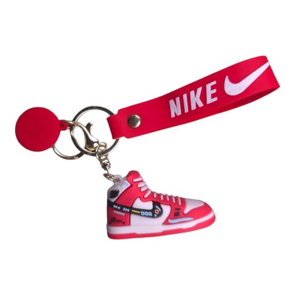 Keychain with mini Nike sneaker in vibrant multicolor design, perfect for sports fans and sneaker en.