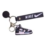 Mini Nike sneaker keychain with multicolor design, perfect for sports fans and sneaker enthusiasts.