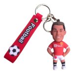 Football keychain featuring Cristiano Ronaldo figurine and team logo, perfect for football fans and.