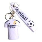Football keychain with Real Madrid jersey design and soccer ball charm.