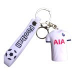 Keychain with football and Tottenham Hotspur jersey design, perfect for football fans and collectors.
