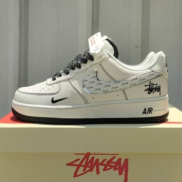 Air Force Low 1 07 White Black sneaker with black accents and branding.