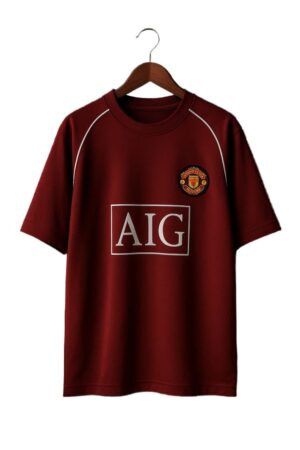 Red Manchester United classic football jersey with club crest and AIG sponsor logo.
