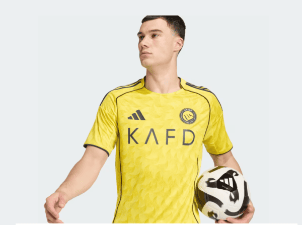 AL Nassr 2025/26 home jersey with team logo and yellow design, perfect for football fans.