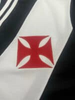 Vasco da Gama football club emblem patch on jersey.