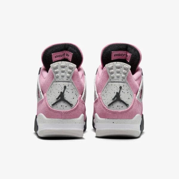 Back view of pink and white Air Jordan 4 Orchid sneakers for women.
