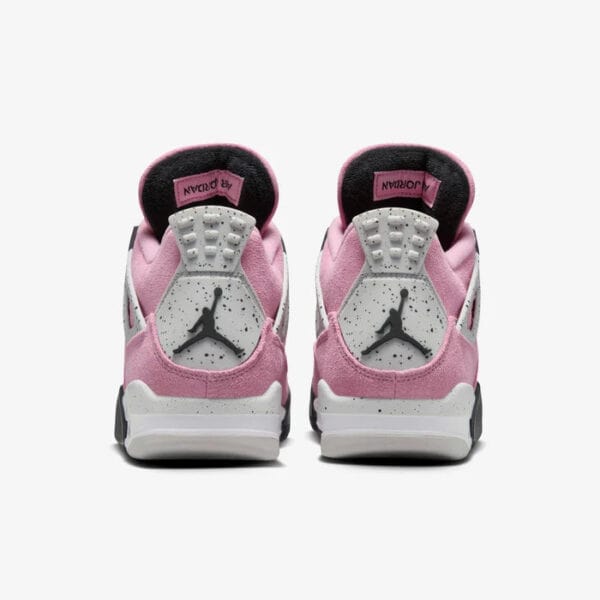 Back view of pink and white Air Jordan 4 Orchid sneakers for women.