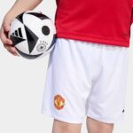 Official Manchester United kids' home football kit for 2025/26 season. Perfect for young fans and pl.