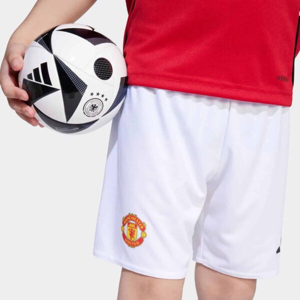 Official Manchester United kids' home football kit for 2025/26 season. Perfect for young fans and pl.