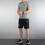 Men's athletic sportswear set in four colors by Adidas.