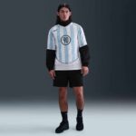 Nike Total 90 soccer jersey in white with light blue stripes and the number 90 on the front.