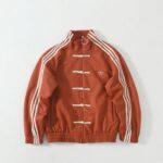 Adidas Chinese Limited Edition casual red unisex jacket with white stripes and toggle closures.