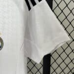 Football jersey with team logo, white color, and breathable fabric. Perfect for sports fans and athl.