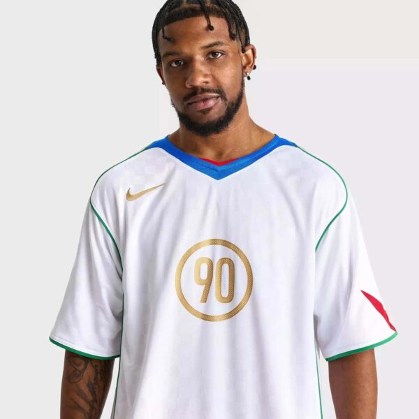 Nike Total 90 men's soccer jersey in white with gold and blue accents.