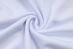 White Adidas tracksuit fabric, smooth and breathable material for athletic wear.