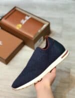 Comfortable navy slip-on shoes for men and women.