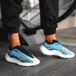 Stylish blue and black Nike Air Max running shoes for men.