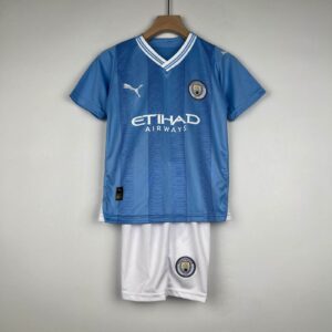 Kids Manchester City home football jersey and shorts for 2023/24 season.