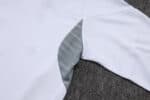 White Adidas tracksuit with grey accents, perfect for sports and casual wear.