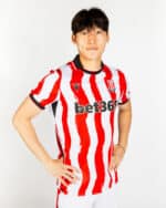 Stoke City 2025/26 home football jersey with red and white vertical stripes, featuring the Bet365 sp.