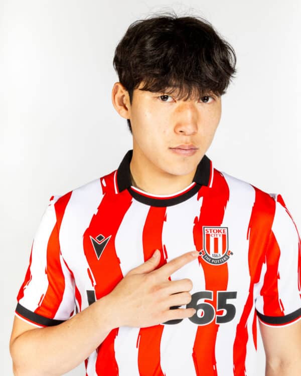 Stoke City 2025/26 home football jersey with red and white stripes, official club crest, and modern.