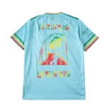 Bob Marley blue football jersey with colorful graphic and inspirational text.