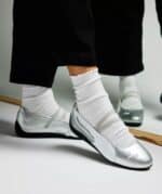 Puma Speedcat racing shoes with sleek silver design and comfortable fit. Perfect for sports and casu.