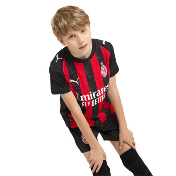 Kids AC Milan home football kit 2025/26 with team logo and red-black stripes.