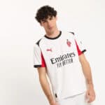 AC Milan soccer jersey with Emirates sponsor logo, Puma branding, and team crest.