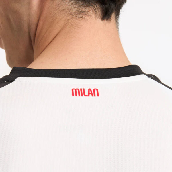 Milan football jersey with "Milan" printed on the back in red.
